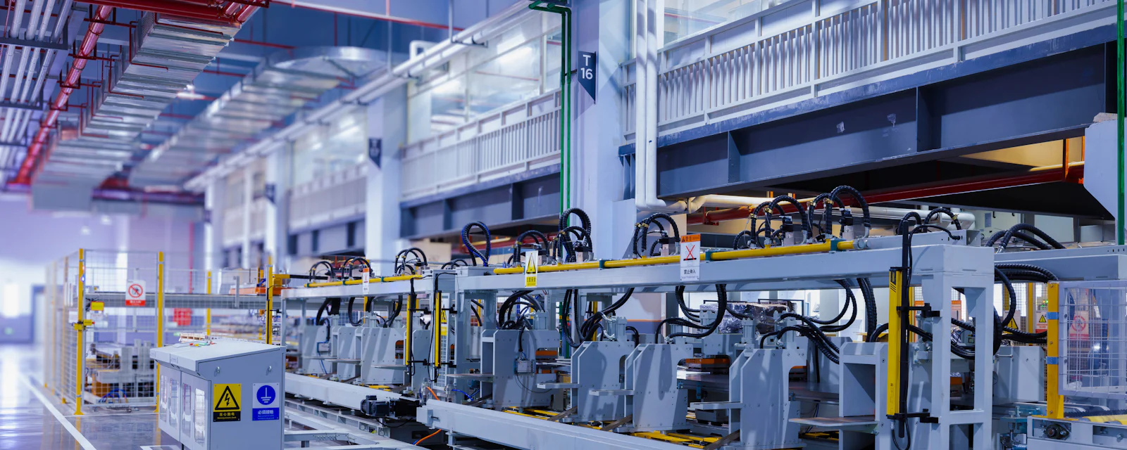 An automated production line inside a bright modern factory