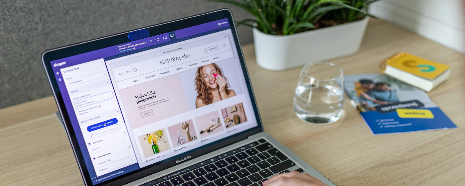Hands on a laptop editing an online store product page